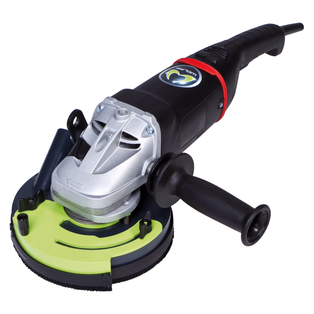 WOLFF_Dummy_15930_BS 180_2017-07 A corded handheld angle grinder with a black plastic body and a silver metal gearbox housing. It features a detachable black side handle, a lime-green protective grinding guard with a brush skirt, and a red accent near the rear. The tool is positioned on a white background, showing the disc interface, ventilation slots, and power cord at the rear.